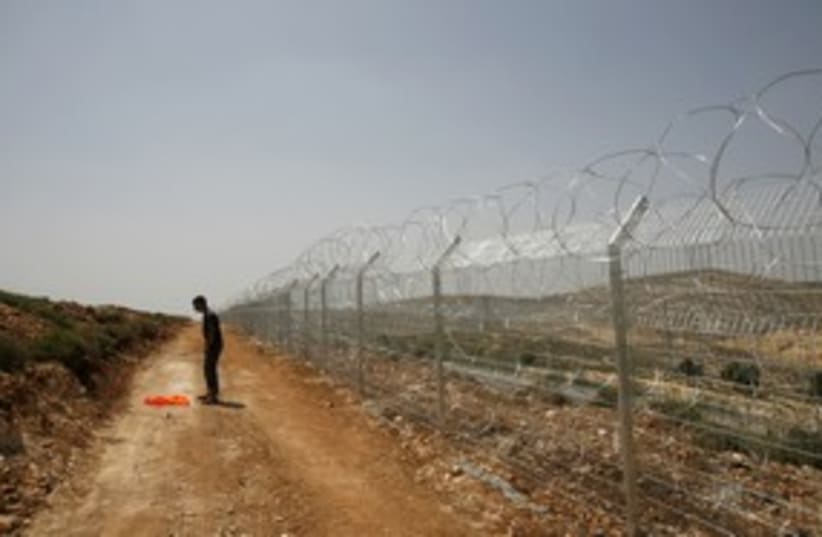 Security fence near Givat Ze'ev 311 (R) (photo credit: REUTERS/Ronen Zvulun)