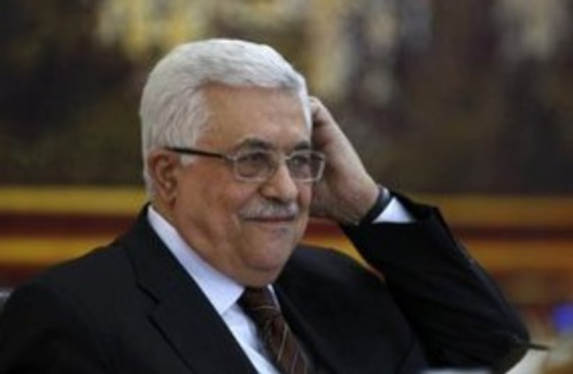 Abbas scratching his head 311 (r) (photo credit: REUTERS/Mohamad Torokman)