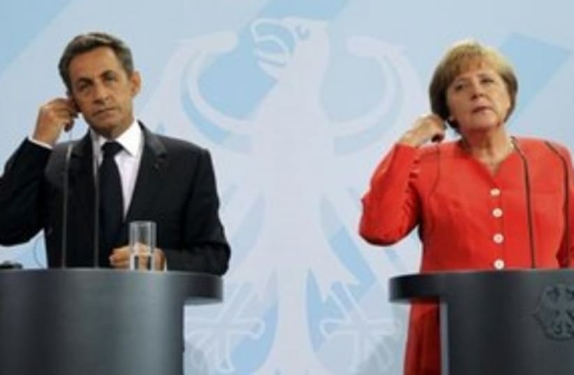 German Chancellor Merkel and French President Sarkozy 311 (R (photo credit: REUTERS)
