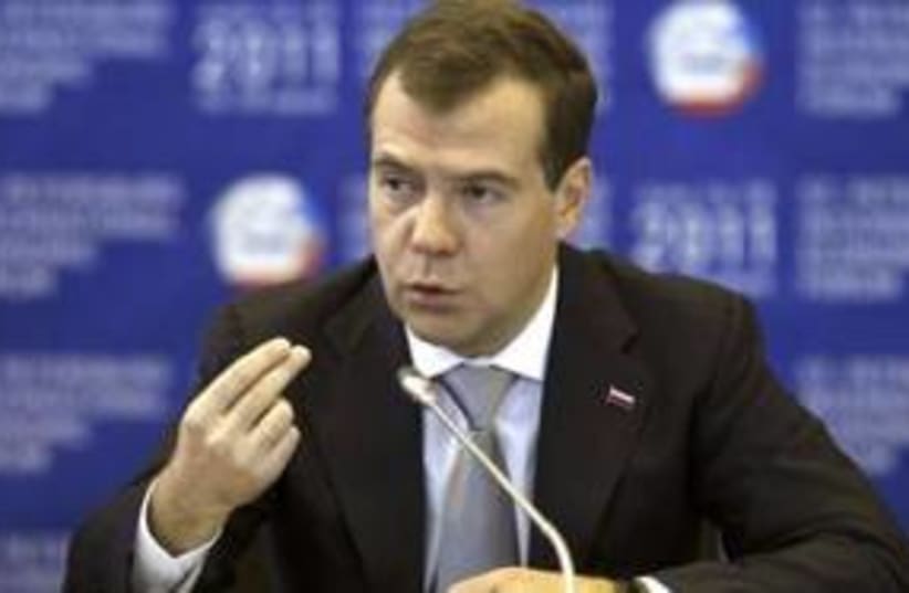 Russian President Dmitry Medvedev 311 (R) (photo credit: REUTERS/Alexander Demianchuk)