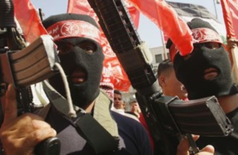 Palestinian PFLP terrorists with guns in Nablus 311 (R) (photo credit: Abed Omar Qusini / Reuters)