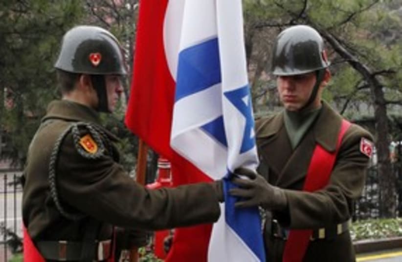 Turkish honor guard passes Israeli and Turkish flags 58 (R) (photo credit: REUTERS)