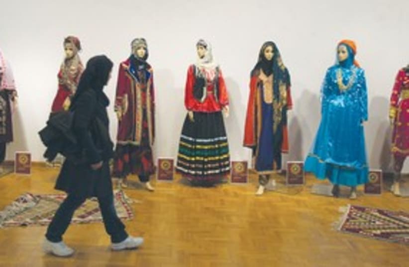 Iranian student walks past mannequins (photo credit: REUTERS)
