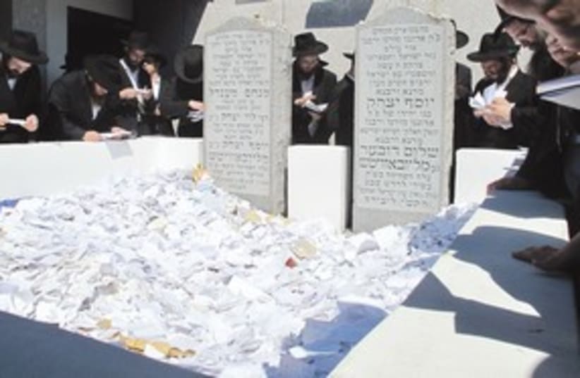 Scraps of paper at Rabbi Schneerson’s grave 311 (photo credit: Gil Shefler)