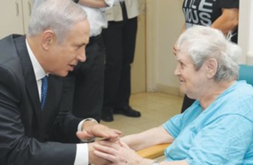 Netanyahu with Holocaust survivor 311 (photo credit: GPO)