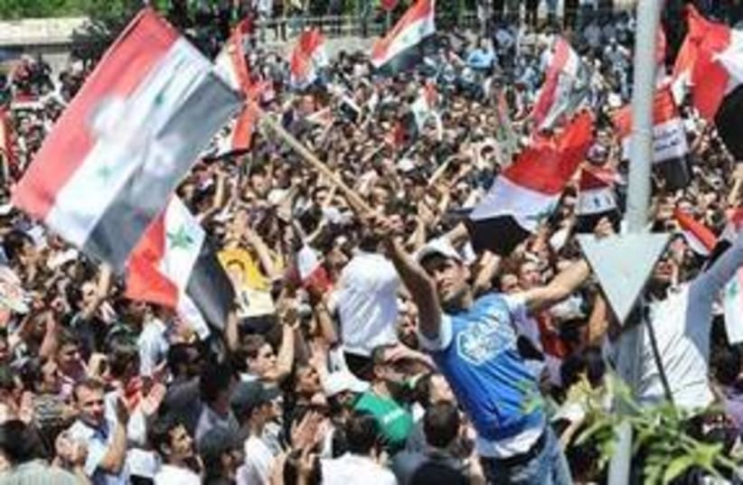 Pro-Assad protesters in Syria 311 (photo credit: REUTERS)