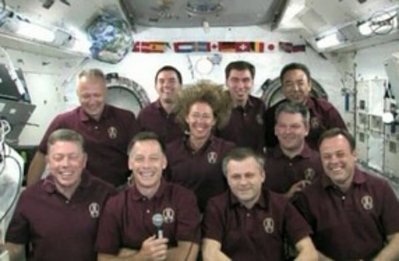 obama phones astronauts_311 (photo credit: REUTERS)
