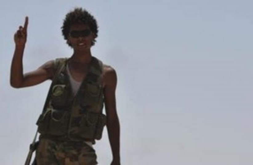 Libyan rebel on the front lines 311 (R) (photo credit: REUTERS/Esam Al-Fetori)
