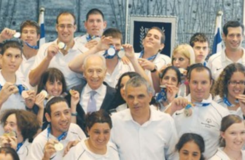 Peres with Special Olympics team 311 (photo credit: Greer Fay Cashman)