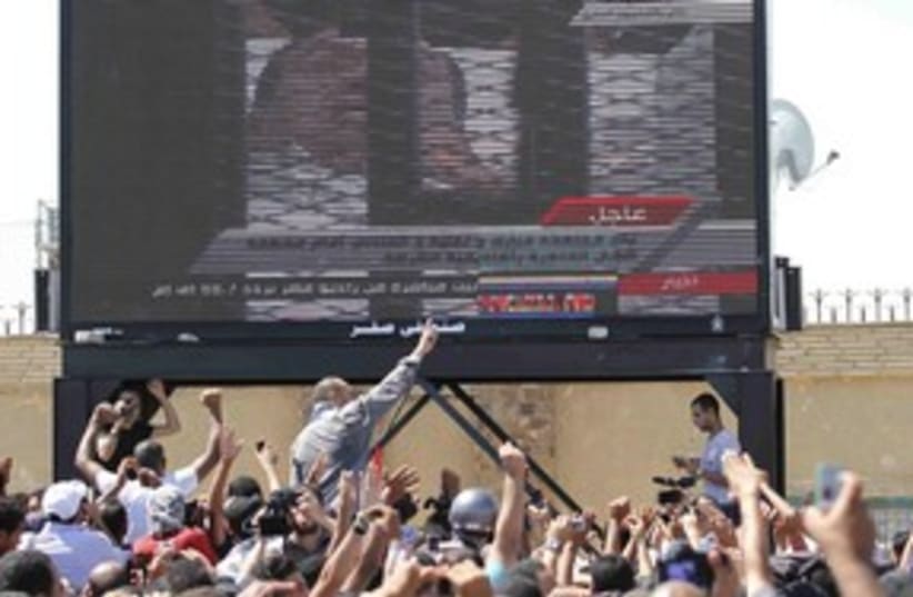 Mubarak trial on tv 311 R (photo credit: REUTERS/Mohamed Abd El-Ghany)
