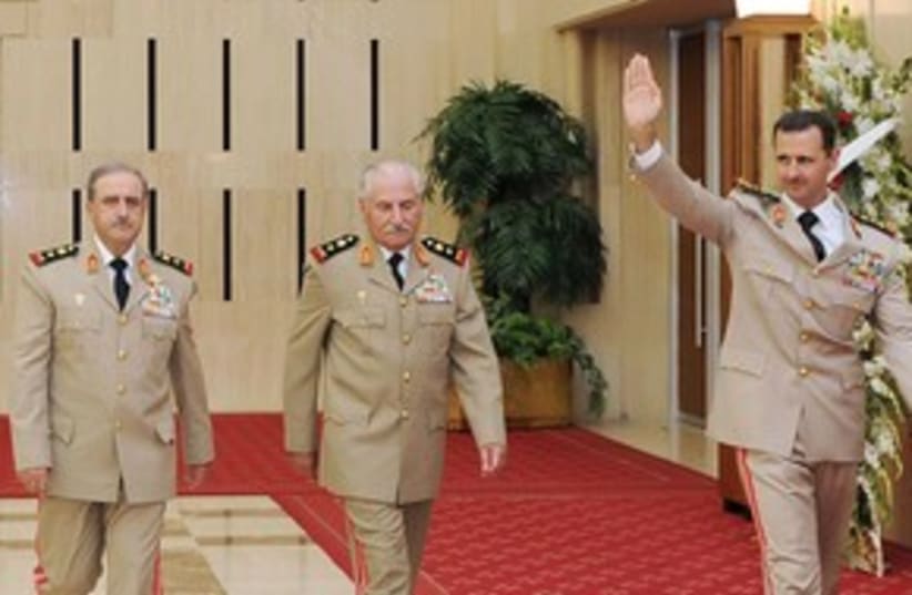 Assad with defense minister and chief of staff 311 (photo credit: REUTERS/Sana)