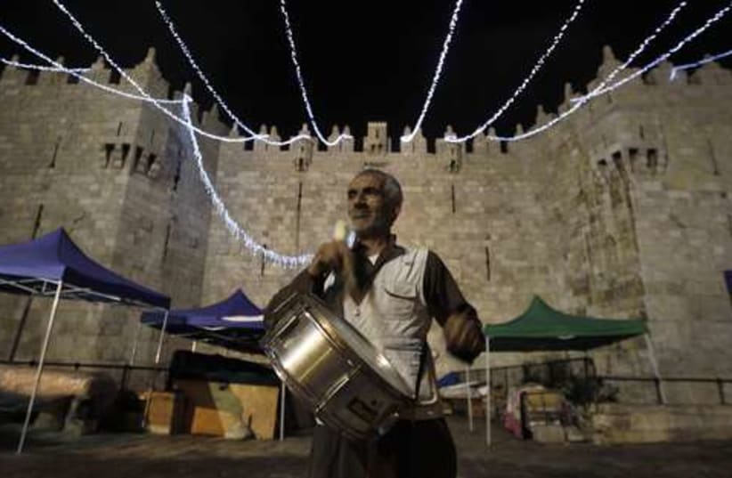 Palestinian call to Ramadan 521 (photo credit: REUTERS/Ammar Awad)