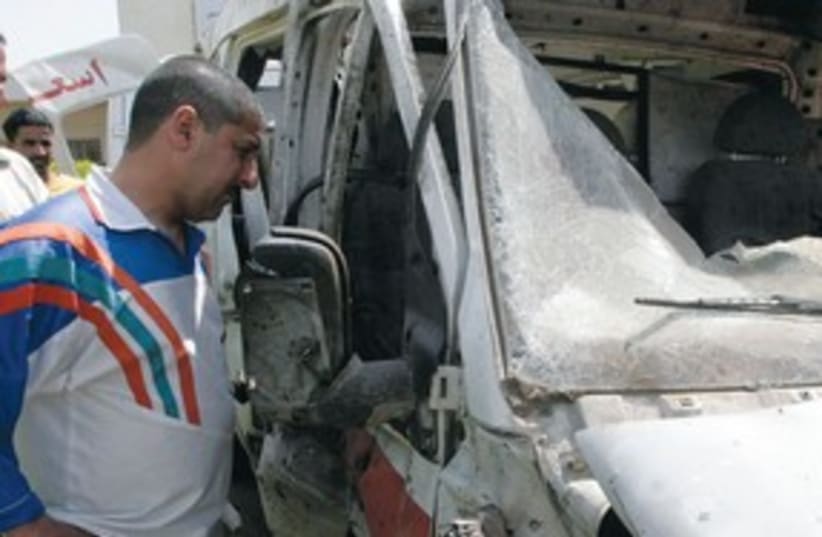 Destroyed ambulance in Iraq311 (photo credit: REUTERS)