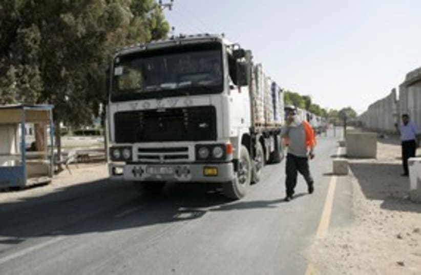 Trucks enter the Gaza Strip 311 (R) (photo credit: REUTERS/Ahmed Zakot)