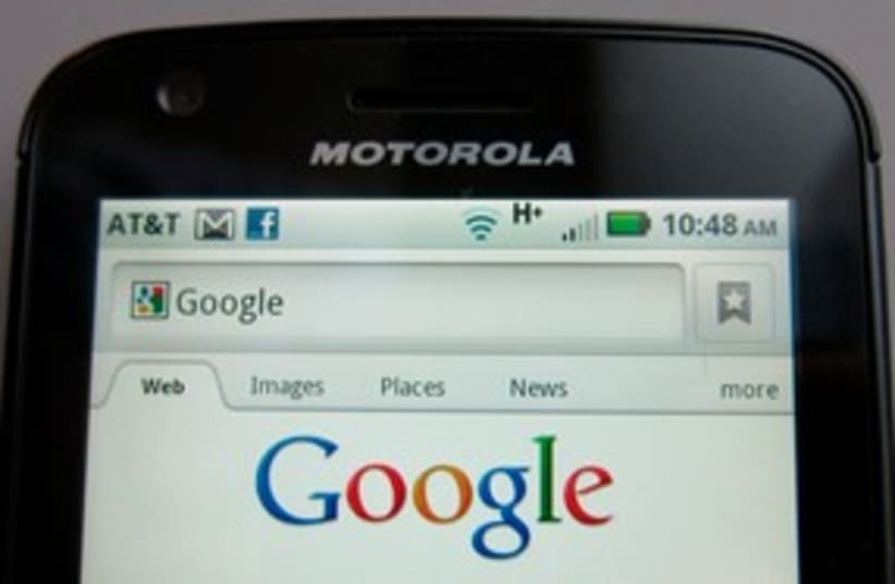 Motorola Droid phone is seen displaying Google search (R) (photo credit: REUTERS/Brendan McDermid)