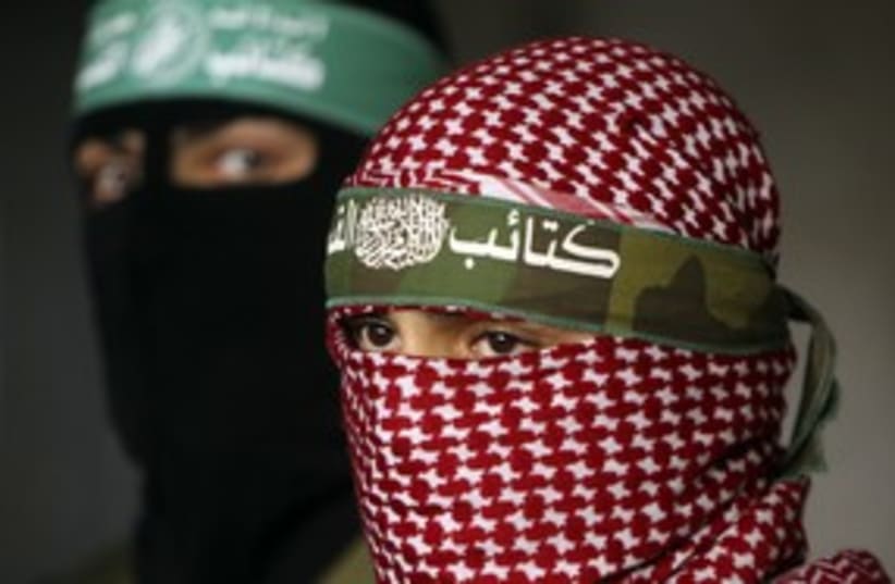 Masked Hamas terrorists 311 (R) (photo credit: Mohammed Salem / Reuters)