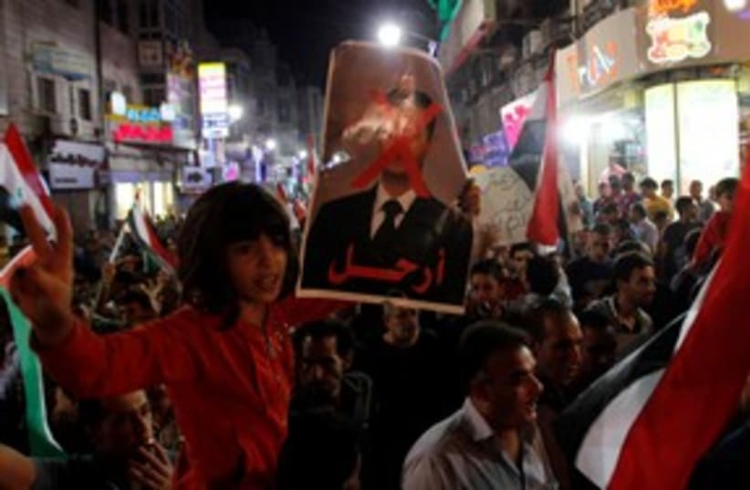 Palestinians at an anti-Assad rally in Ramallah 311 (R) (photo credit: REUTERS/Mohamad Torokman)
