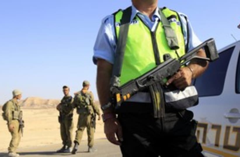 Police, soldiers after Eilat attack 311 (photo credit: REUTERS/Ronen Zvulun)