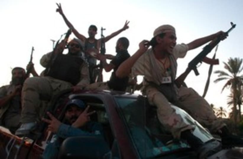 Libyan rebels celebrate 311 (photo credit: REUTERS)