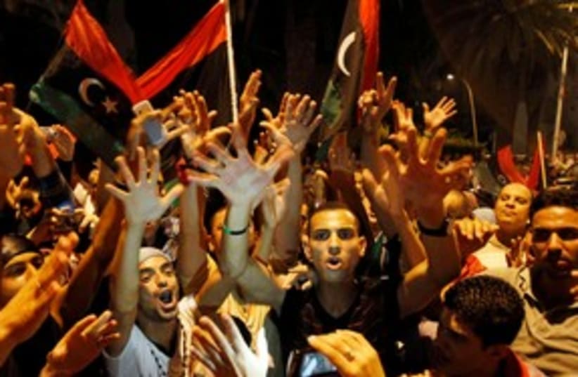 Libyans celebrating the capture of Tripoli 311 (R) (photo credit: REUTERS/Zoubeir Souissi)