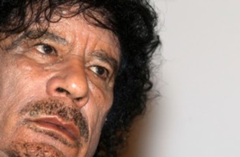 Libyan leader Muammar Gaddafi dishevled sad greasy 311 (R) (photo credit: REUTERS/Jacky Naegelen)