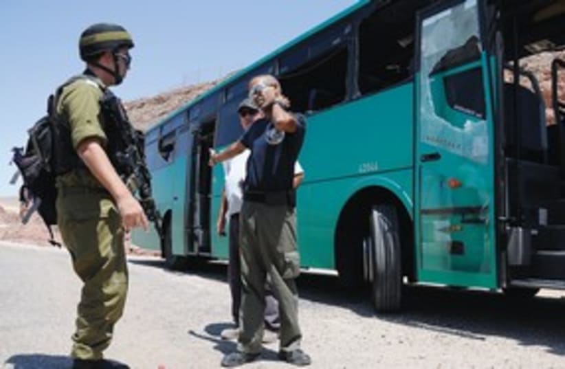Soldier at bombed Eilat bus_311 (photo credit: Reuters)