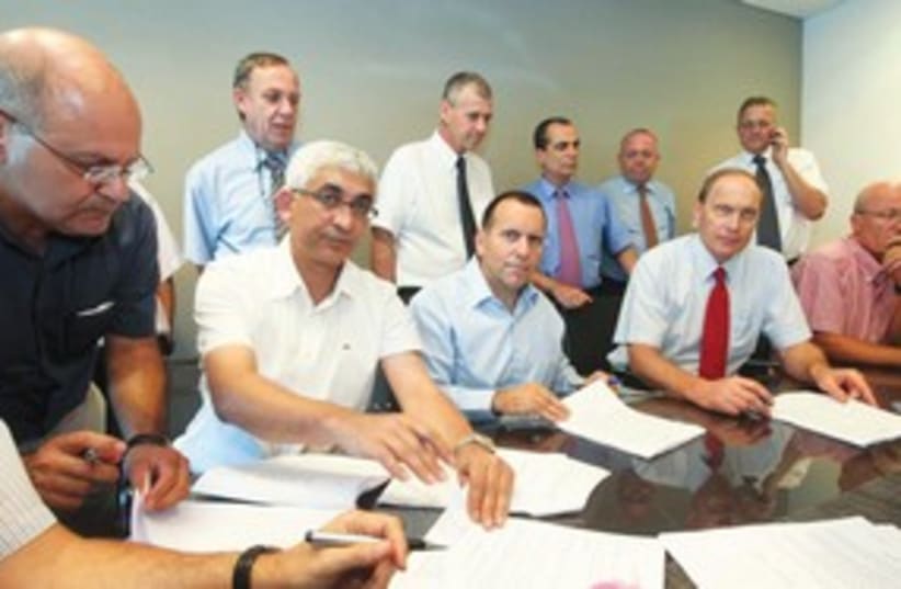 REPRESENTATIVES OF the IMA and Treasury sign an agreement (photo credit: Assaf Shilo/Israel Sun)