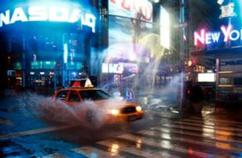 taxi speeds by on 42nd Street at Times Square in New York 31 (photo credit: REUTERS/Peter Jones)
