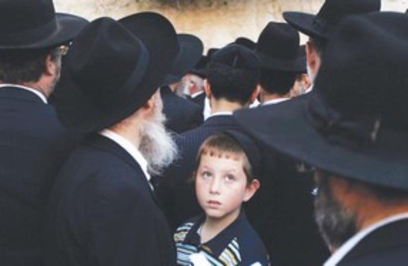 Haredi child in crowd of black hats (photo credit: REUTERS)