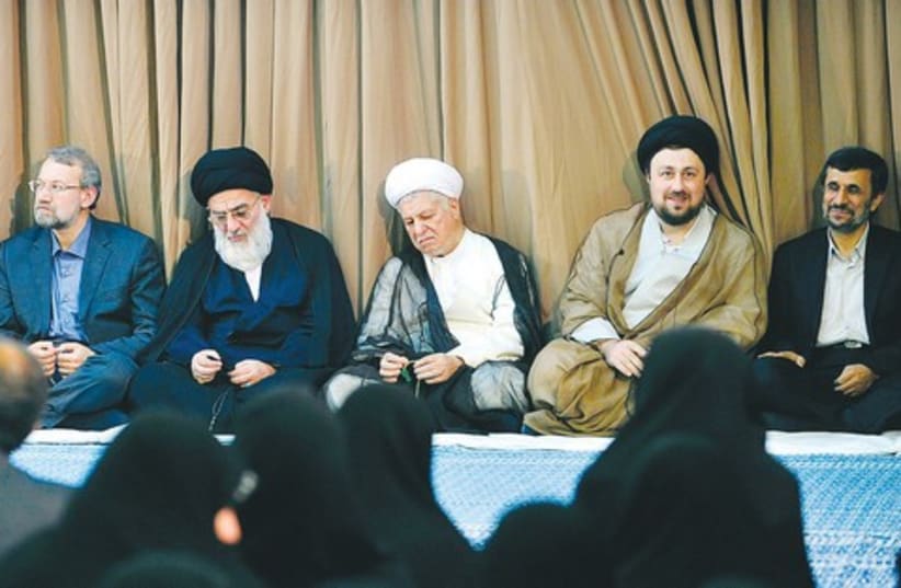 Khameini Amhmadinejad and clerics_521 (photo credit: Reuters)