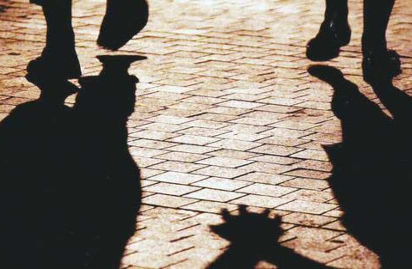 Couple holding hands shadow 521 (photo credit: Marc Israel Sellem)
