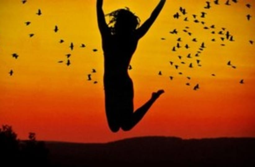 Woman jumping with sunset in background 311 (photo credit: Courtesy)