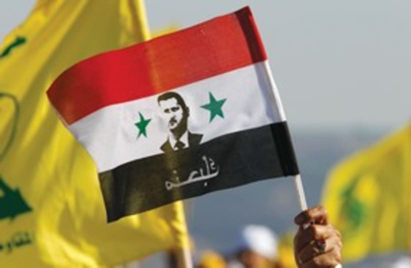 Bashar Assad flag (photo credit: Reuters)