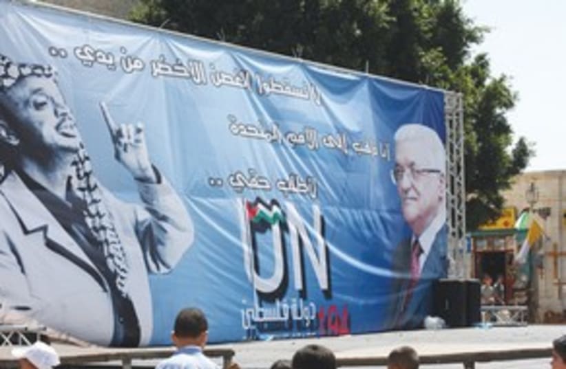 A SIGN displaying the images of Yasser Arafat, Abbas (photo credit: Ben Hartman)