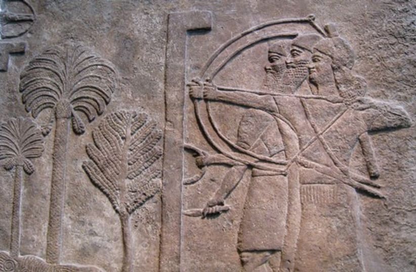 A relief depitcting Assyrian archers  521 (photo credit: Wikimedia Commons)