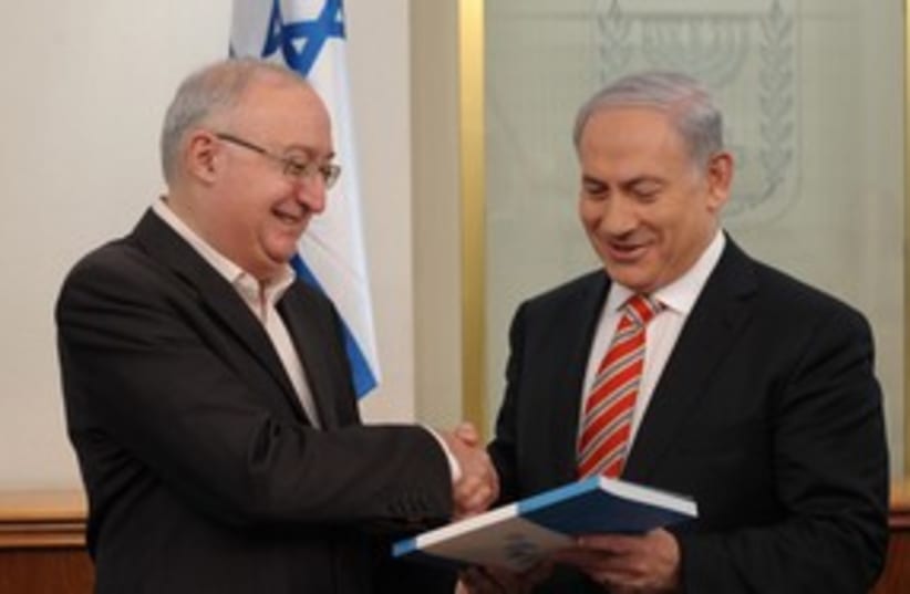 Prof. Trajtenberg hands recommendations to PM Netanyahu [file] (photo credit: GPO)