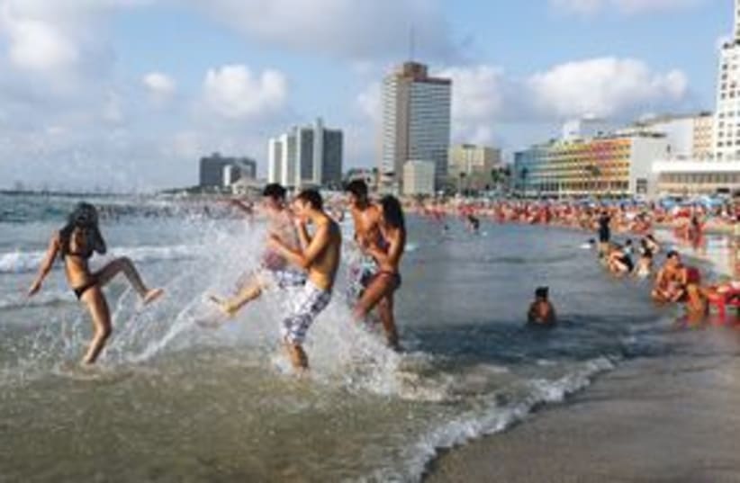 Playing in the water at a Tel Aviv beach 311 (photo credit: Marc Israel Sellem/The Jerusalem Post)