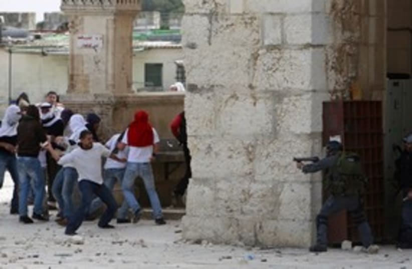 Palestinians, Israeli police clash at Temple Mount 311 (R) (photo credit: Ammar Awad / Reuters)