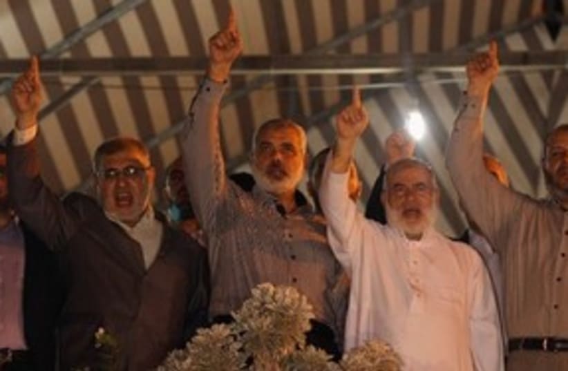 Hamas PM Haniyeh celebrates prisoner deal in Gaza 311 (photo credit: Reuters)