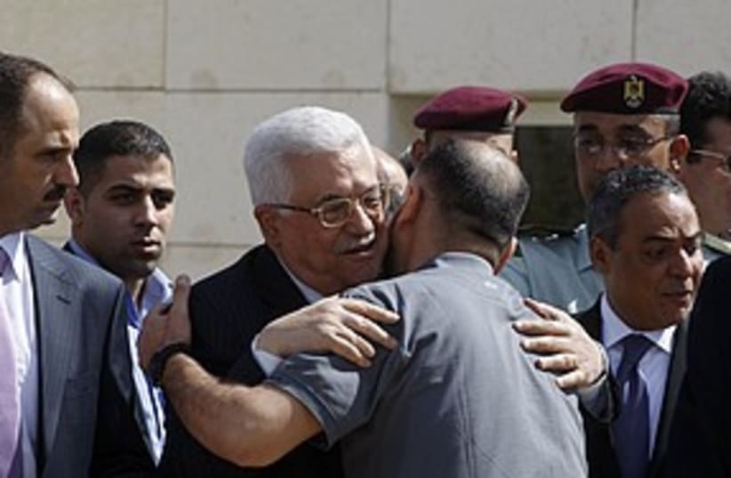 Abbas greets prisoners 311 R (photo credit: REUTERS/Abed Omar Qusini)