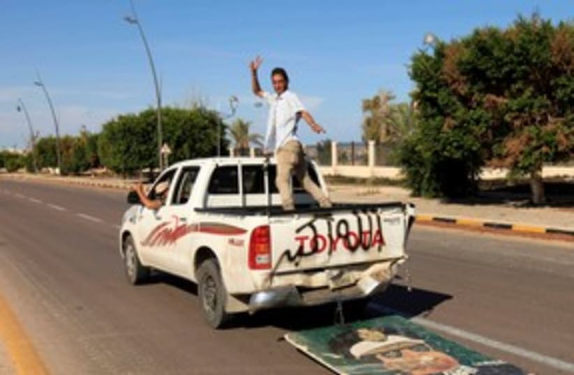 Anti-Gaddafi forces after fall of Sirte R 311 (photo credit: ESAM OMRAN AL-FETORI/ REUTERS)