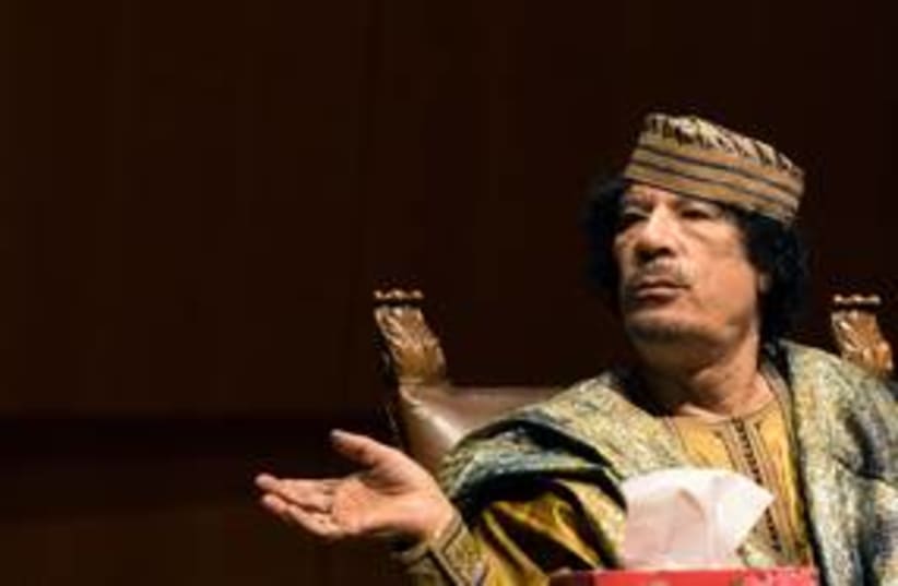 Former Libyan leader Muammar Gaddafi 311 (R) (photo credit: REUTERS/Alessandro Bianchi)