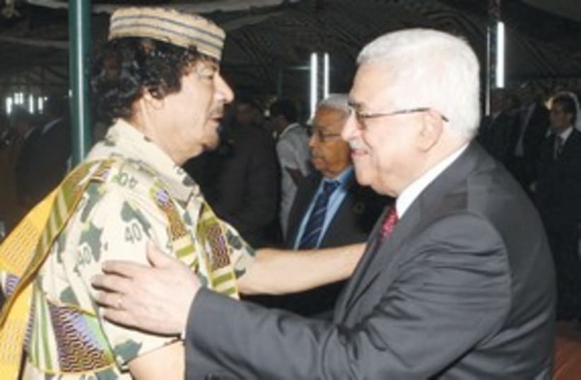 Mahmoud Abbas with Muammar Gaddafi 311 (R) (photo credit: Reuters)
