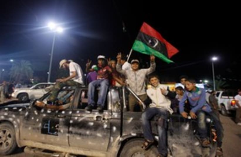 Libyans celebrate death of Gaddafi 311 (photo credit: REUTERS)