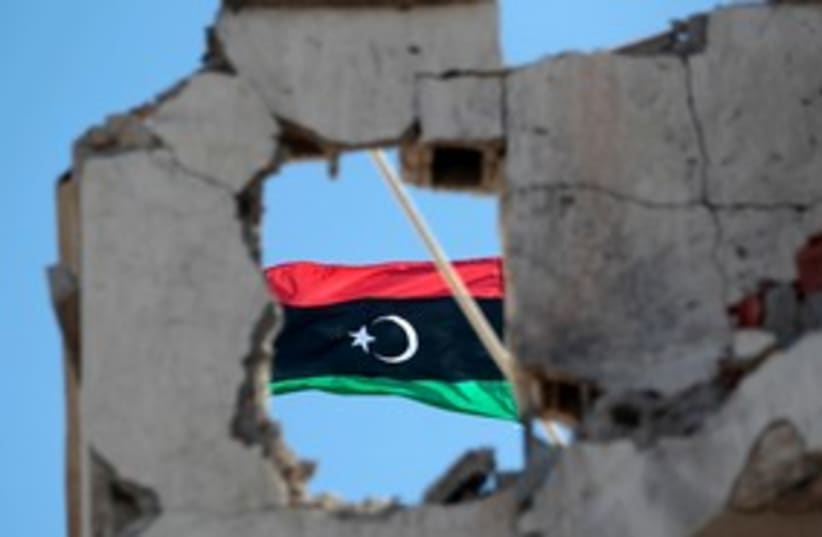 Libya flag 311 (R) (photo credit: REUTERS/Thaier al-Sudani)
