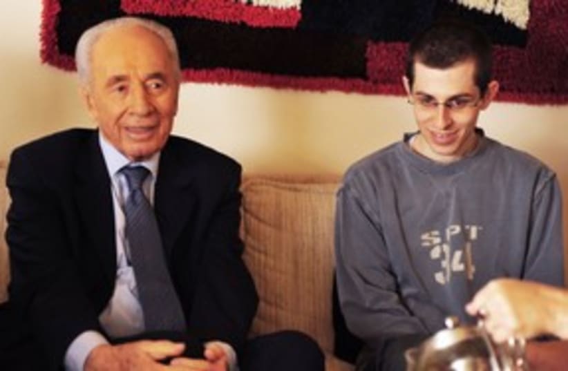 President Shimon Peres with Gilad Schalit 311 (R) (photo credit: REUTERS/Ziv Binunsky/Handout)
