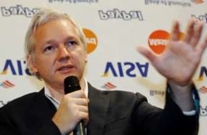 WikiLeaks founder Julian Assange speaks to press 311 (R) (photo credit: REUTERS/Luke MacGregor)