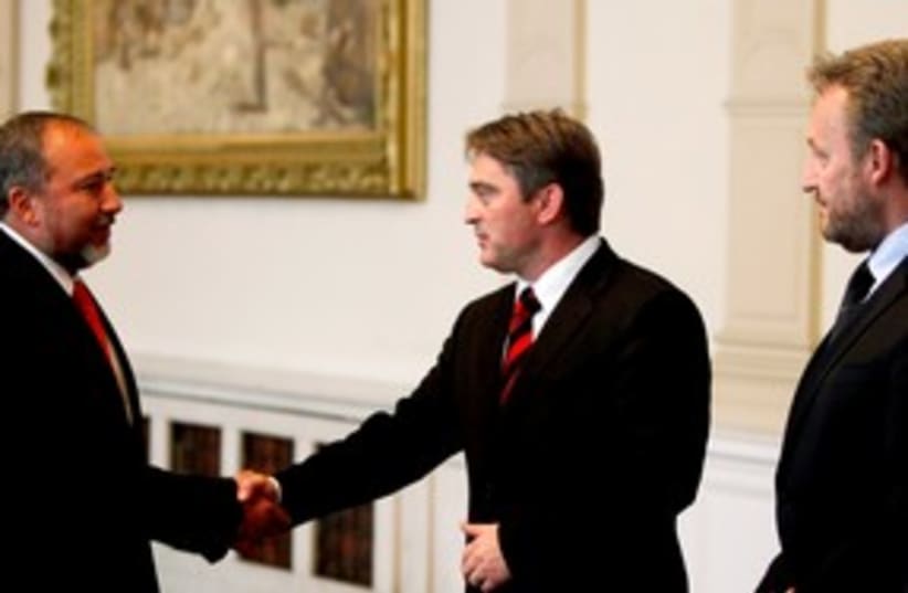 Lieberman with Chairman of Bosnia Presidency Zeljko Komsic (photo credit: Kevin Lamarque / Reuters)
