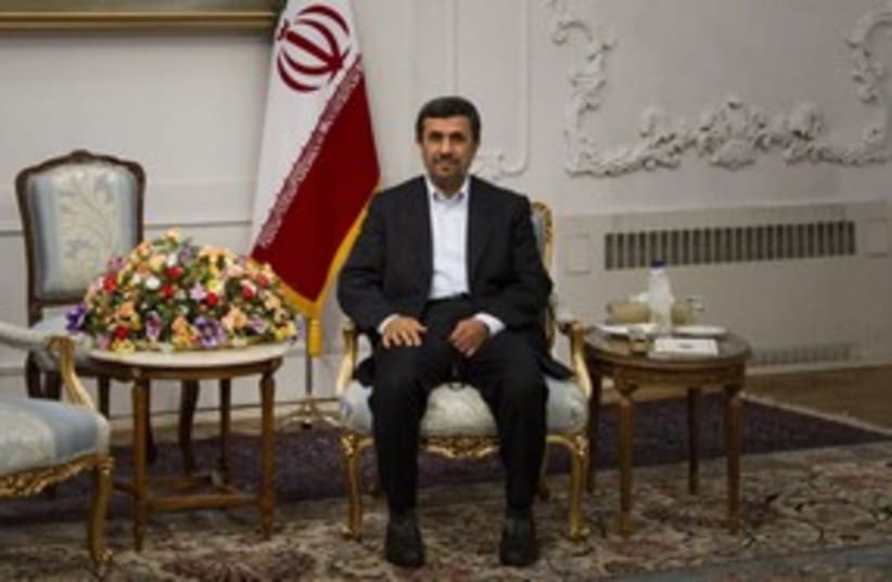Iranian Ahmadinejad sitting pretty_311 (photo credit: Reuters)