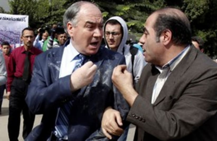 Member of Syrian opposition egged by demonstrators (photo credit: Reuters)